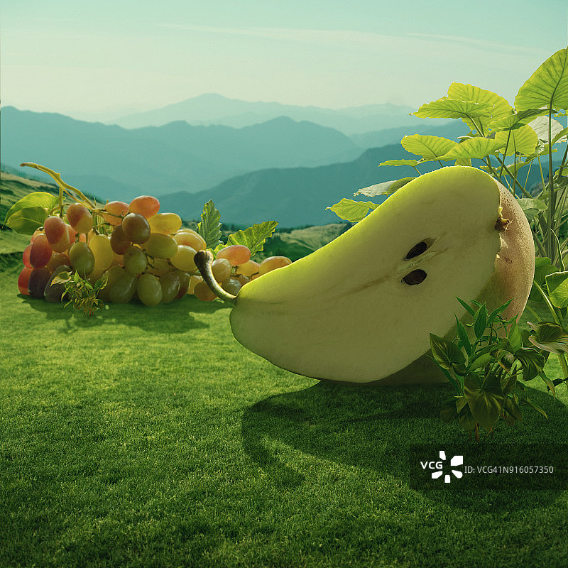 山地田野中超现实的巨型梨和葡萄图片素材