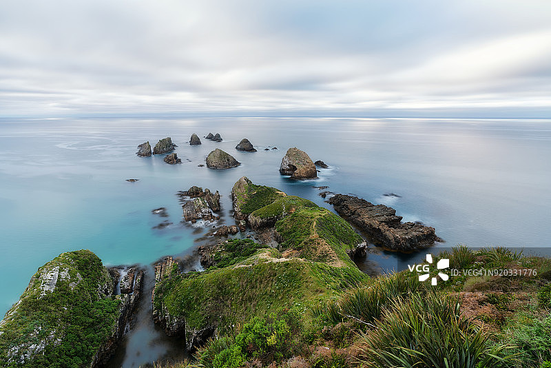 新西兰奥塔哥地区卡特林斯日落时分的纳吉特角图片素材
