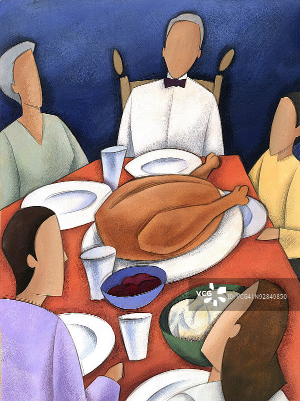 一家人在桌旁享用感恩节盛宴图片素材