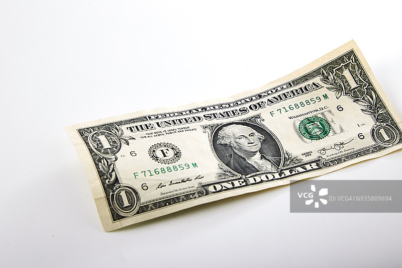 白色背景上独立的一美元纸币图片素材