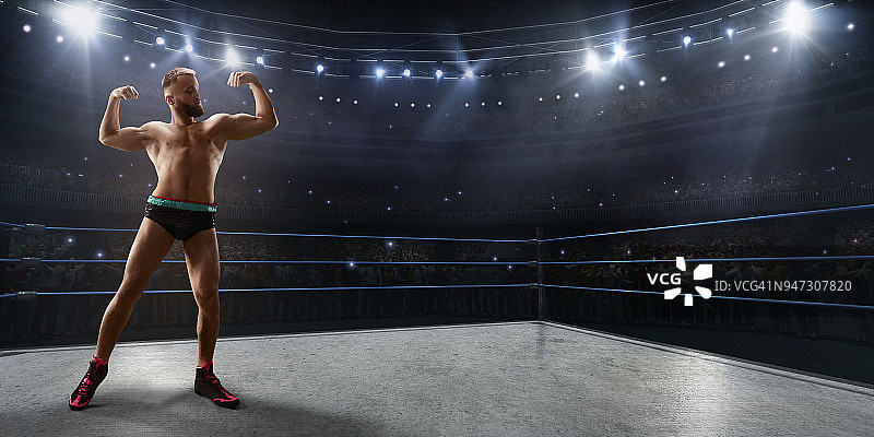 摔跤表演：运动服面具摔跤手在擂台上图片素材