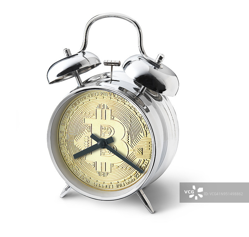 带有比特币和不高兴表情的闹钟图片素材