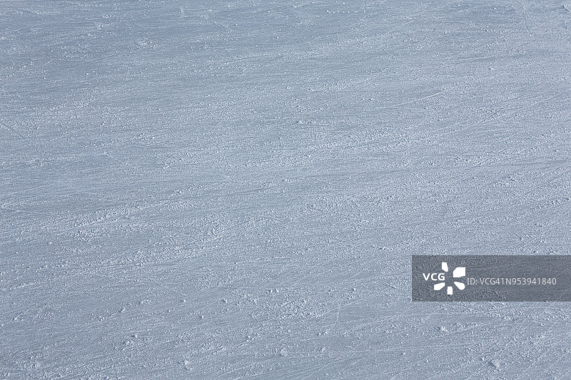 溜冰场冰面抽象背景与滑冰痕迹图片素材