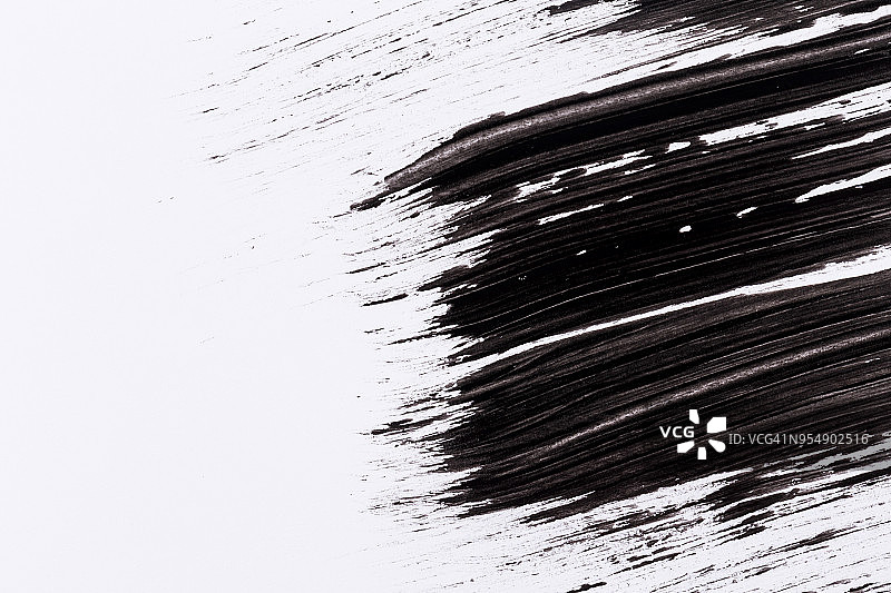 白色纸上的黑色油漆图片素材