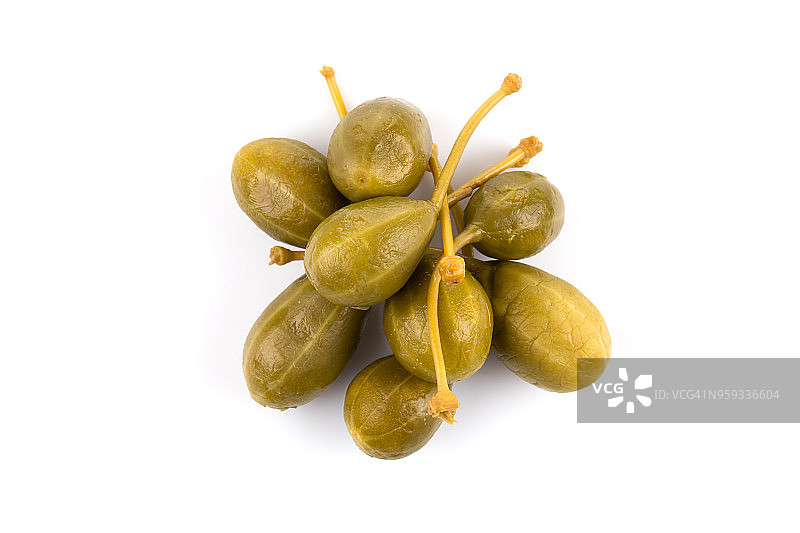 白色背景上的罐装刺山柑花蕾堆图片素材