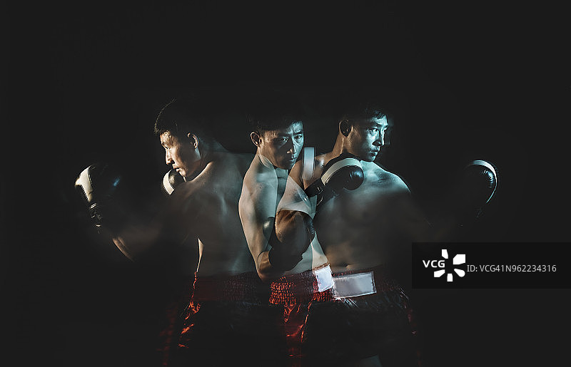 戴拳击手套的华裔男性多重曝光图片素材