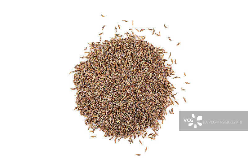 白色背景上的小茴香籽堆图片素材