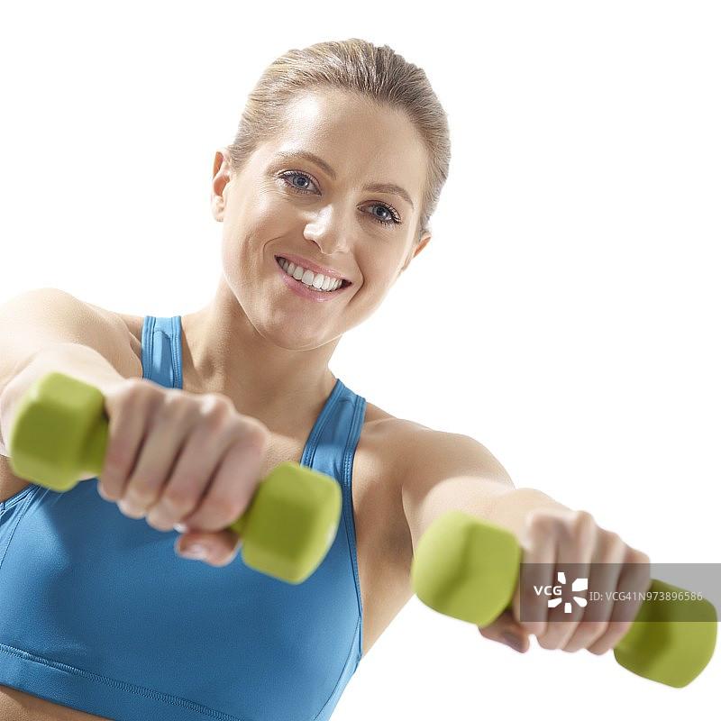 女人使用手部重量器械图片素材