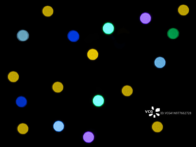 粉色绿色紫色光束交织抽象图案特写图片素材