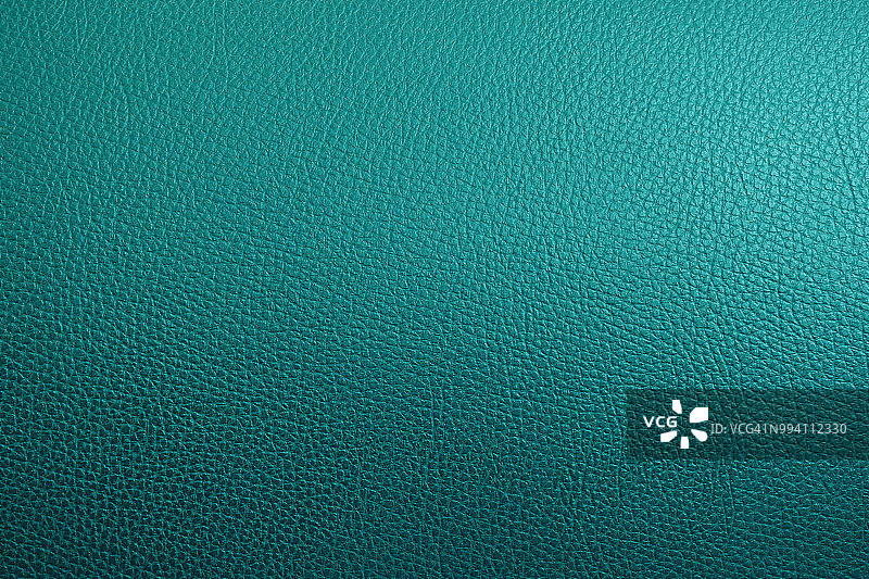 家具中的绿松石和黑色真皮纹理背景。图片素材