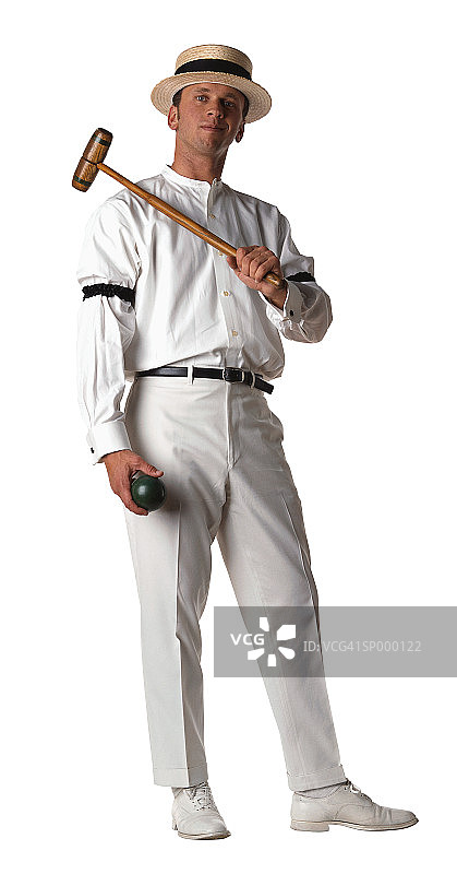 手持槌球和木槌的男子图片素材