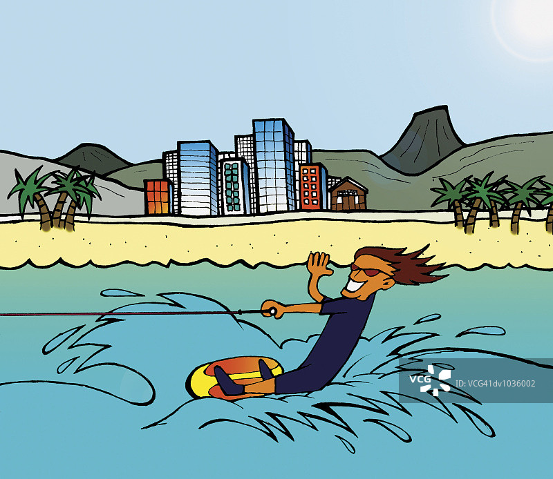 在海上滑水并挥手的年轻男人图片素材