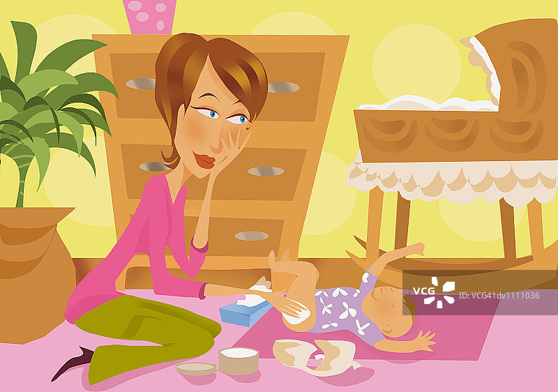 母亲给新生儿换尿布图片素材