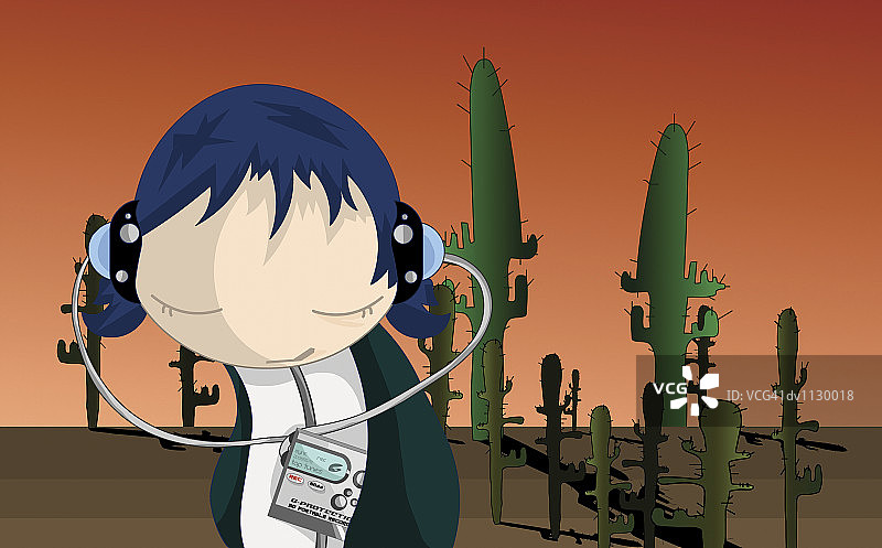 在沙漠中听个人立体声的青少年男孩肖像图片素材