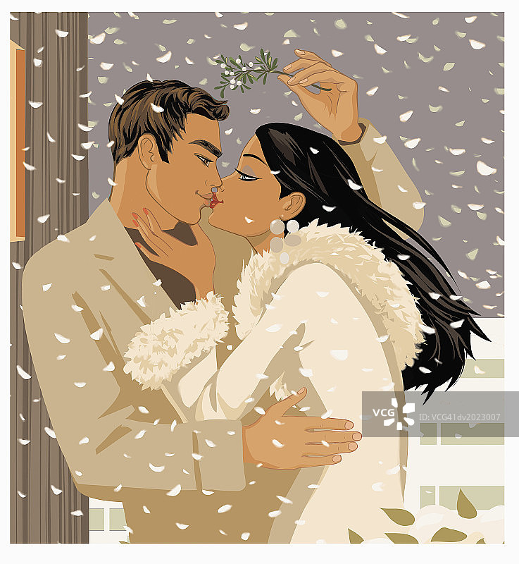 在雪地里槲寄生下亲吻的情侣图片素材