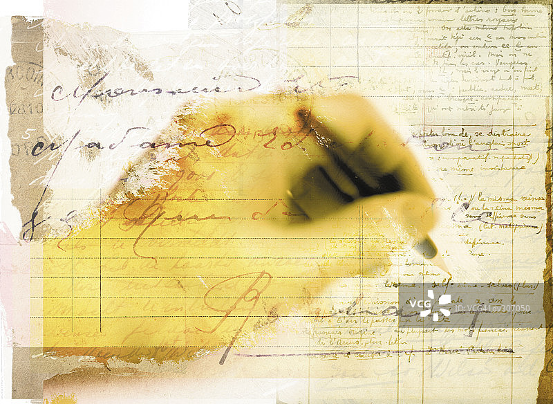 手持笔在手写字体上书写图片素材