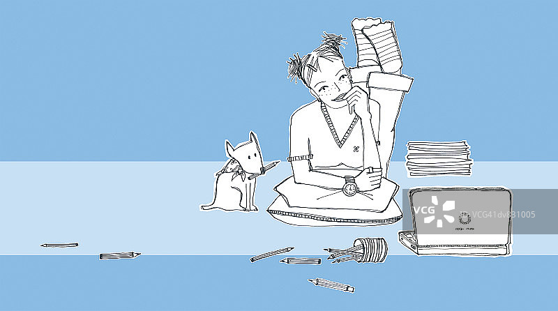 躺在地上打开笔记本电脑的少女肖像图片素材