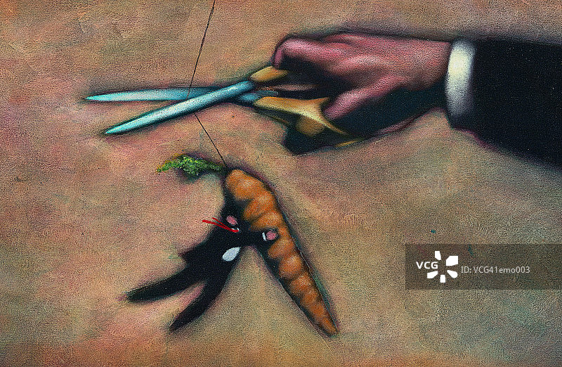 男人紧抓胡萝卜图片素材