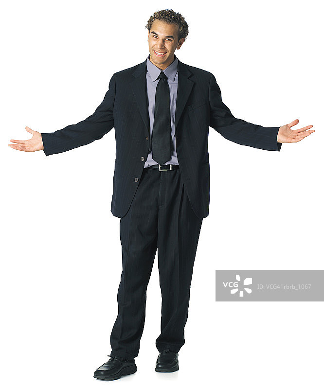 身穿深色西装的年轻白人商务男士耸肩摊手图片素材