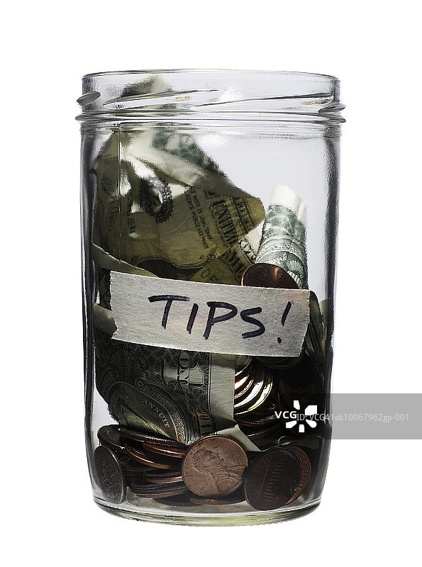 白色背景上的小费罐图片素材