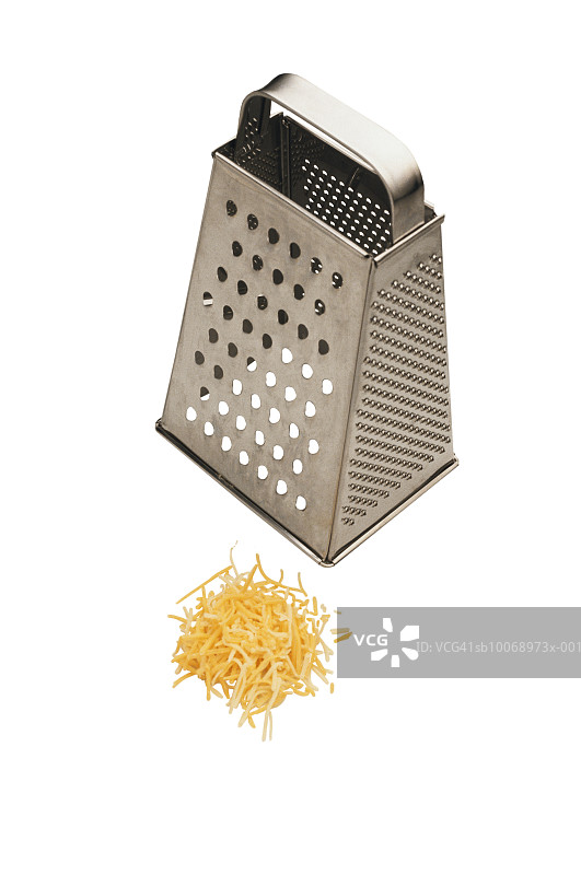 奶酪刨丝器和奶酪，工作室拍摄图片素材