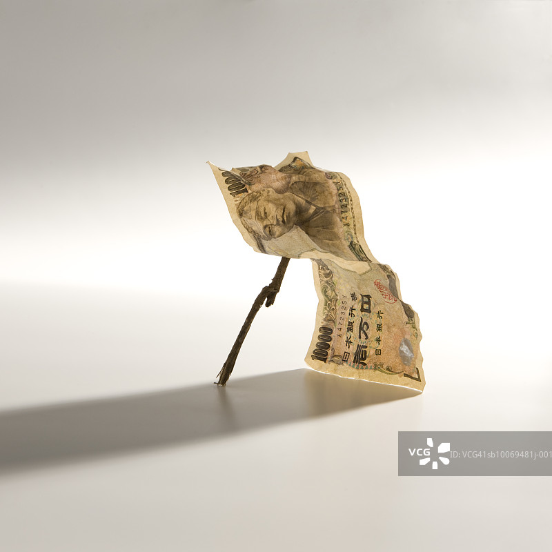 棍子支撑的日元纸币图片素材