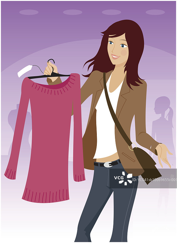 年轻女人手持束腰外衣在衣架上图片素材