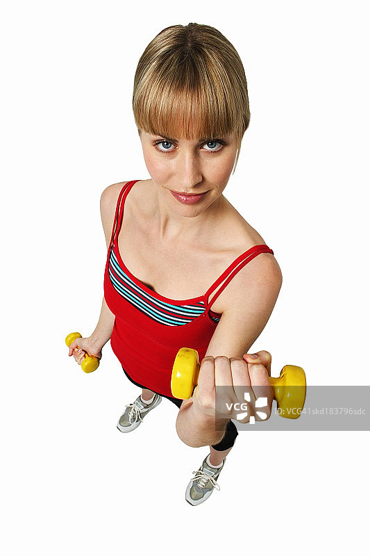 年轻女人举哑铃的俯视角度图片素材