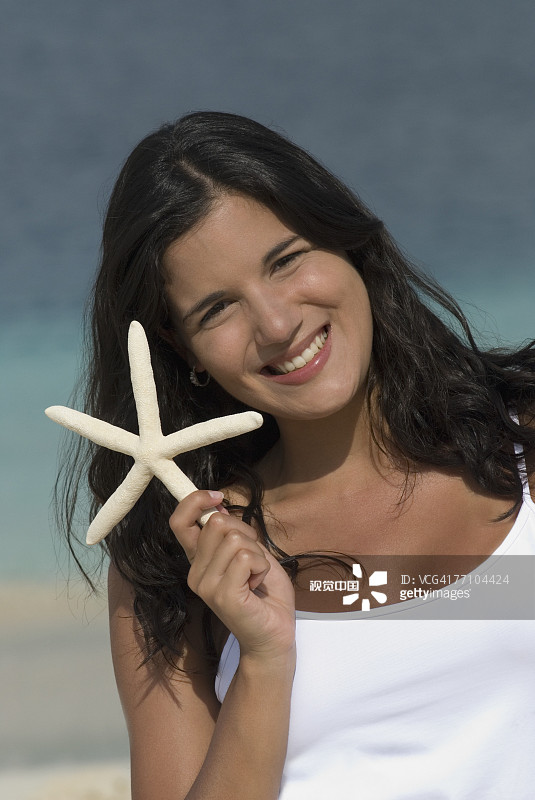 西班牙女人拿着海星图片素材